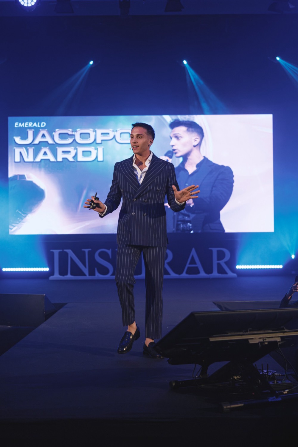 Jacopo on the Inspirar stage, with his name on the big screen